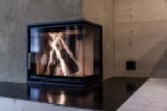 Cozy up in front of this stunning fireplace! This property boasts a modern, sleek design with a beautiful black countertop.