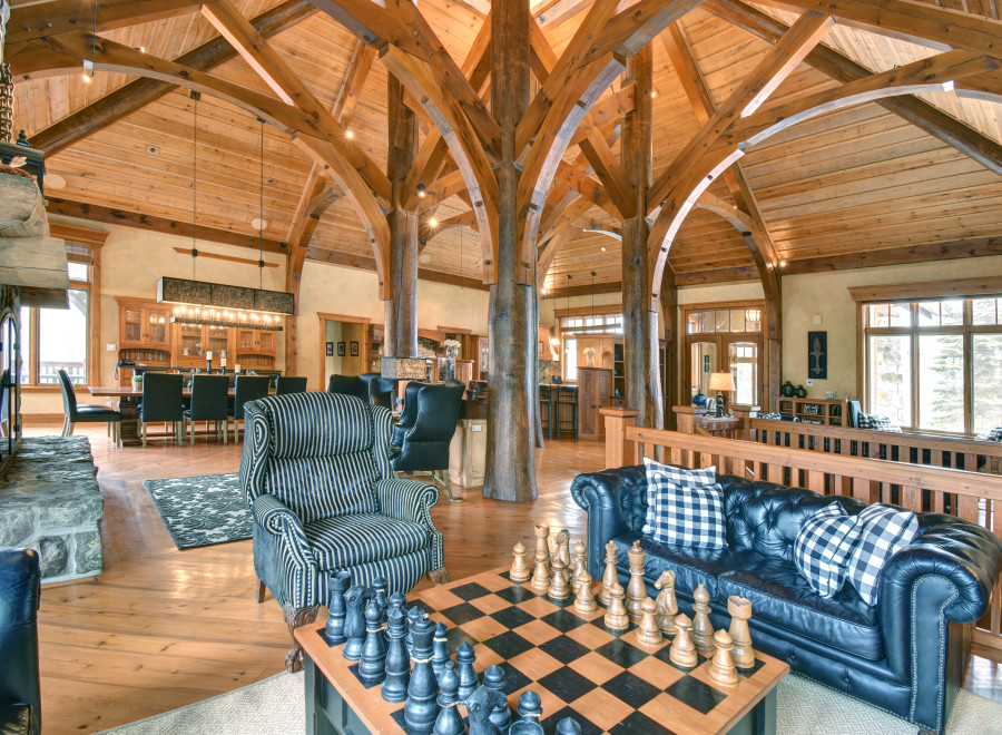 Experience luxury living in this stunning property featuring a unique wooden beam ceiling and a cozy fireplace.