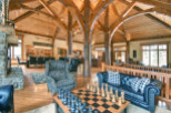 Experience luxury living in this stunning property featuring a unique wooden beam ceiling and a cozy fireplace.