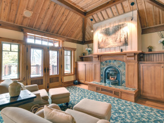 This stunning living room boasts a cozy fireplace, perfect for chilly evenings.