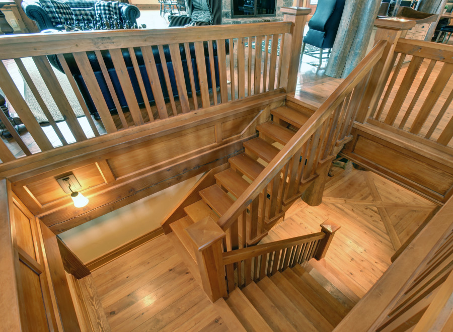 This stunning property boasts a beautifully crafted wooden staircase, adding a touch of rustic elegance to the interior.