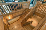 This stunning property boasts a beautifully crafted wooden staircase, adding a touch of rustic elegance to the interior.