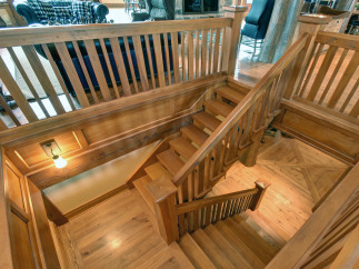 This stunning property boasts a beautifully crafted wooden staircase, adding a touch of rustic elegance to the interior.