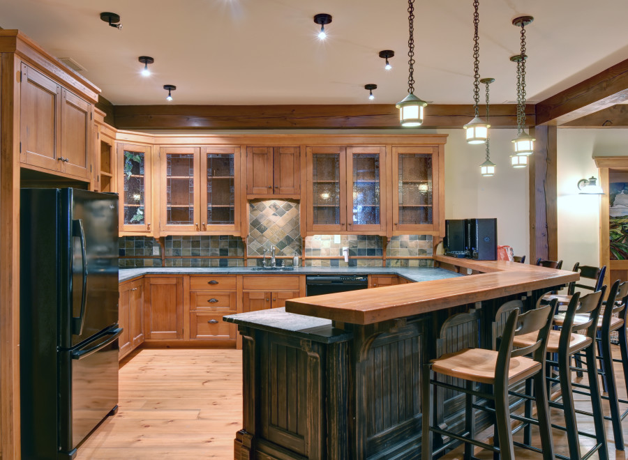This stunning kitchen boasts custom wooden cabinetry and a spacious layout, perfect for both cooking and entertaining.