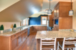 This stunning kitchen boasts custom cabinetry and granite countertops, creating a warm and inviting atmosphere.