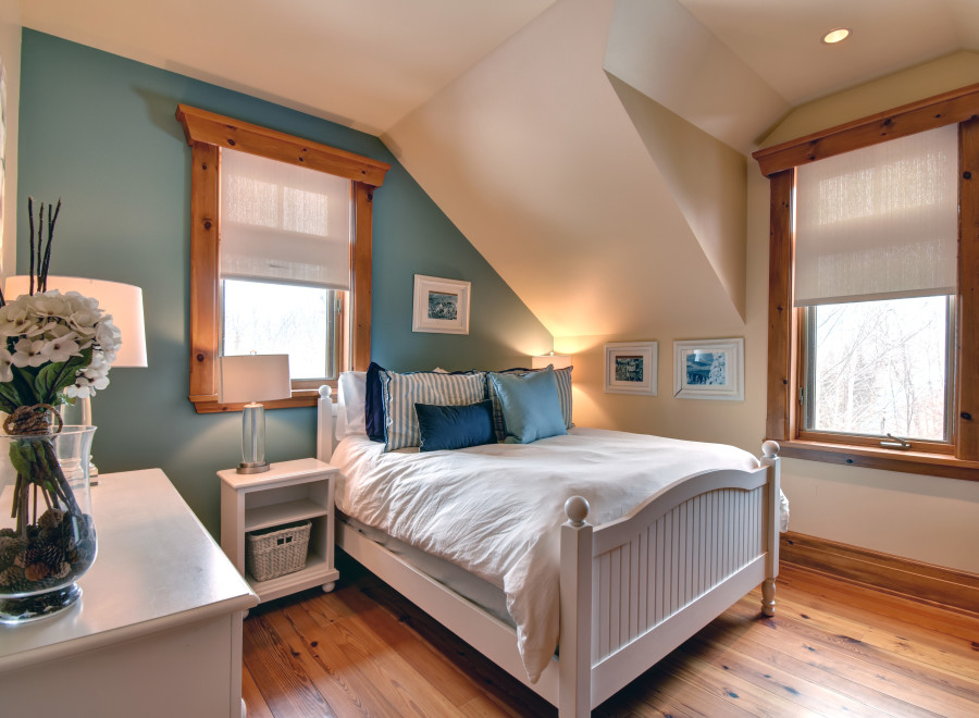 This charming bedroom features a cozy ambiance with its inviting decor and natural light.