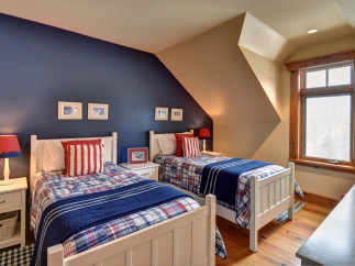 This cozy bedroom features two twin beds, perfect for a guest room or kids' space.