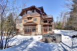 This stunning property boasts a beautiful exterior with a unique architectural design.