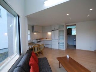 Discover a bright and airy living space with a modern kitchen and dining area.