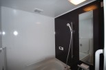 This modern bathroom features a sleek design with contrasting black and white walls.