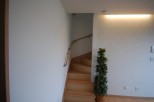 Discover a beautifully designed interior with a charming staircase leading to the upper levels.