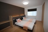 This cozy bedroom features two comfortable beds, perfect for guests or roommates.
