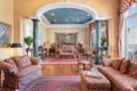 Step into luxury with this exquisite bedroom, boasting elegant columns and a stunning arched ceiling.