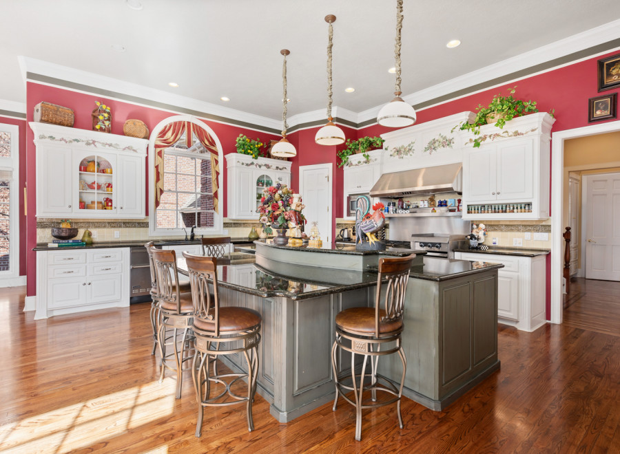 This stunning kitchen boasts a spacious island with seating, perfect for entertaining.