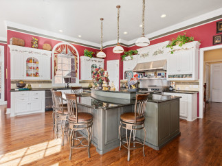 This stunning kitchen boasts a spacious island with seating, perfect for entertaining.