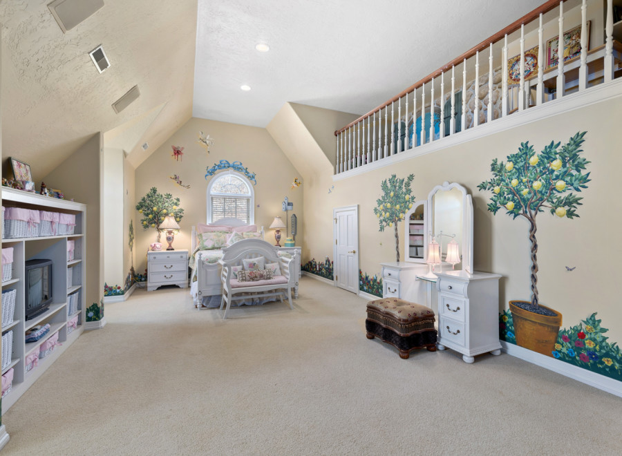 Step into a whimsical bedroom retreat! This charming space features a unique loft area, perfect for relaxation or play.