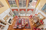 Experience luxury living in this stunning property, featuring a grand living room with soaring ceilings and abundant natural light.