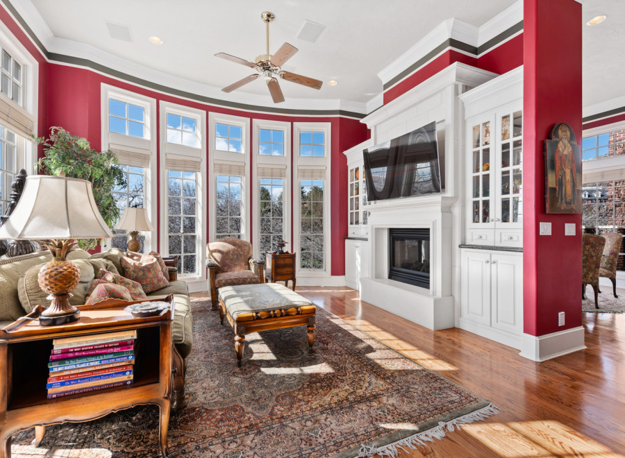 Step into luxury with this stunning living room! Featuring a cozy fireplace, elegant built-ins, and a beautiful rug, this space is perfect for relaxation and entertaining.