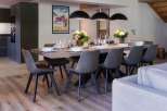 This stunning property boasts a spacious open-plan living area with a large dining table perfect for entertaining.