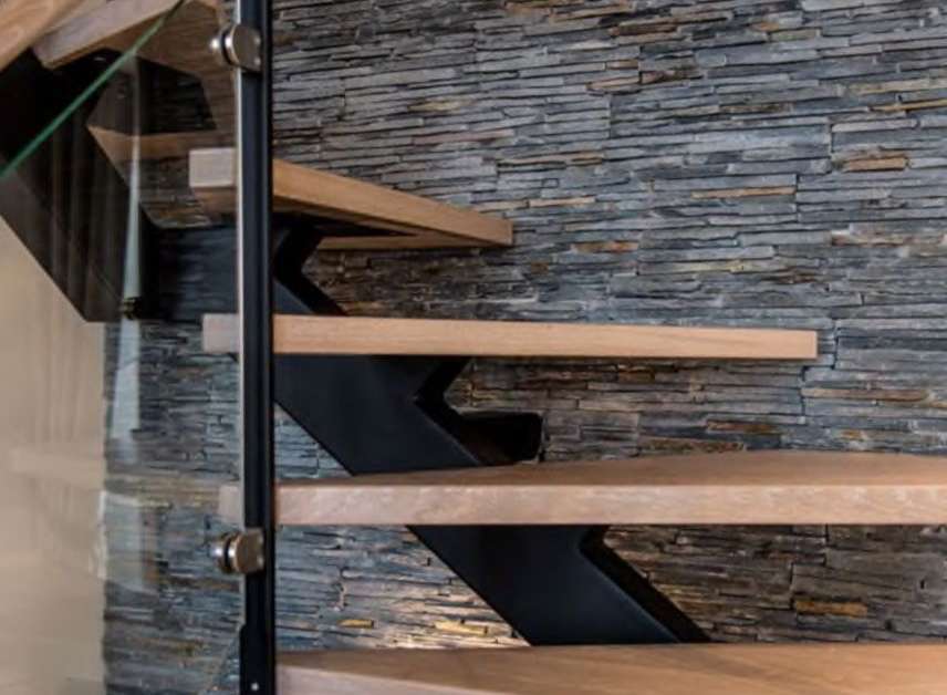 Modern floating staircase with sleek metal accents and light oak treads.