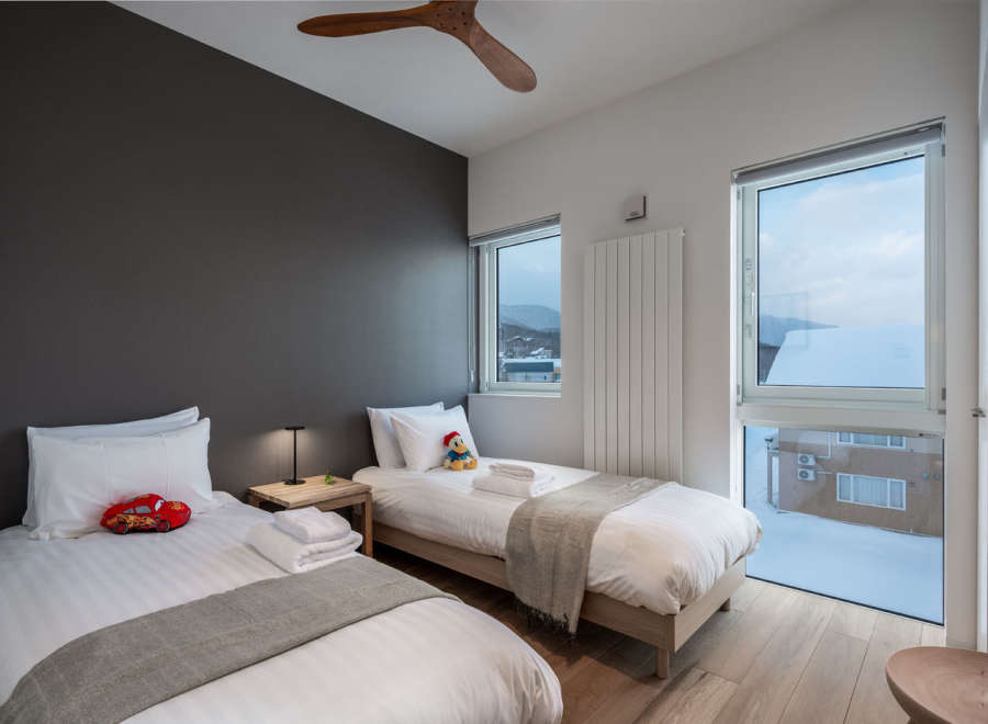 This cozy bedroom features two twin beds, perfect for a family getaway.