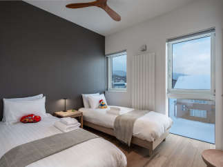 This cozy bedroom features two twin beds, perfect for a family getaway.