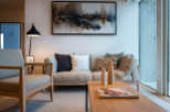 This stunning living room boasts a light and airy feel, thanks to its large windows and neutral color palette.