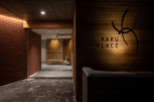 Kakku Place boasts a sleek and modern design, featuring a stunning wooden facade and a welcoming entrance.