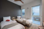 This cozy bedroom features two twin beds, perfect for a family getaway.