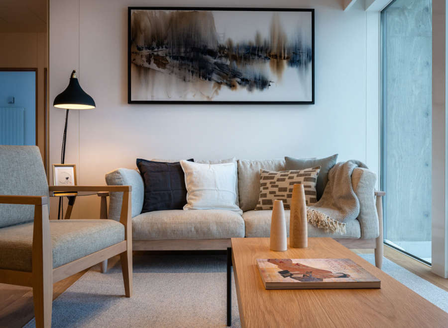 This stunning living room boasts a light and airy feel, thanks to its large windows and neutral color palette.