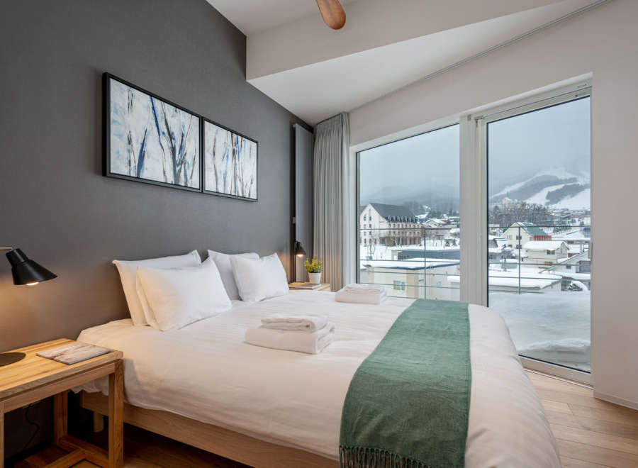 Wake up to breathtaking views of snow-capped mountains from this cozy bedroom.
