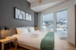 Wake up to breathtaking views of snow-capped mountains from this cozy bedroom.