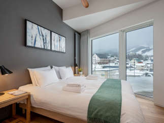 Wake up to breathtaking views of snow-capped mountains from this cozy bedroom.