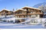 Luxury chalet in snowy mountain setting with stunning views.