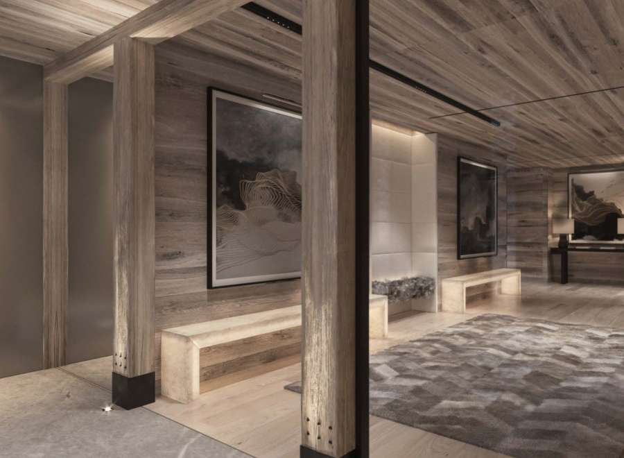 This luxurious property boasts a stunning entryway with wood-paneled walls and ceilings, creating a warm and inviting atmosphere.