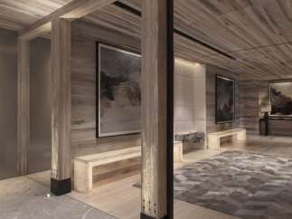 This luxurious property boasts a stunning entryway with wood-paneled walls and ceilings, creating a warm and inviting atmosphere.