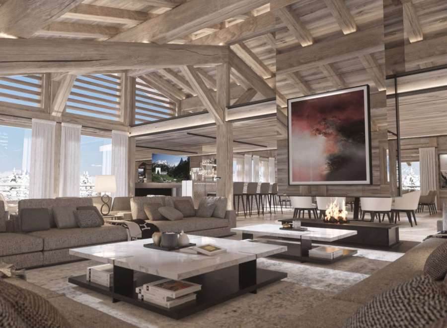 This luxurious chalet boasts a spacious open-plan living area with soaring ceilings and exposed wooden beams, creating a warm and inviting atmosphere.