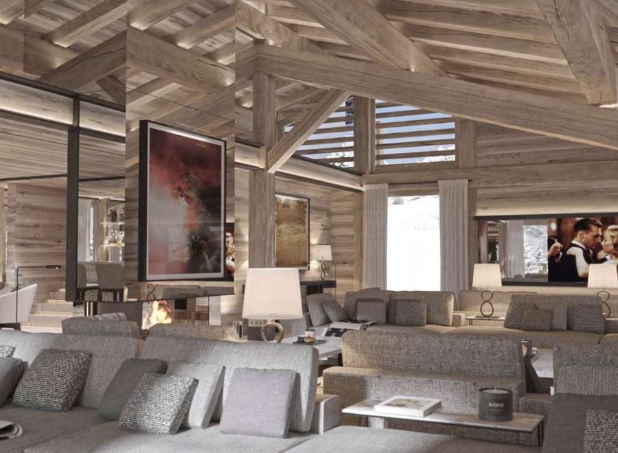 This luxurious chalet boasts a stunning open-plan living area with exposed wooden beams and a cozy fireplace.