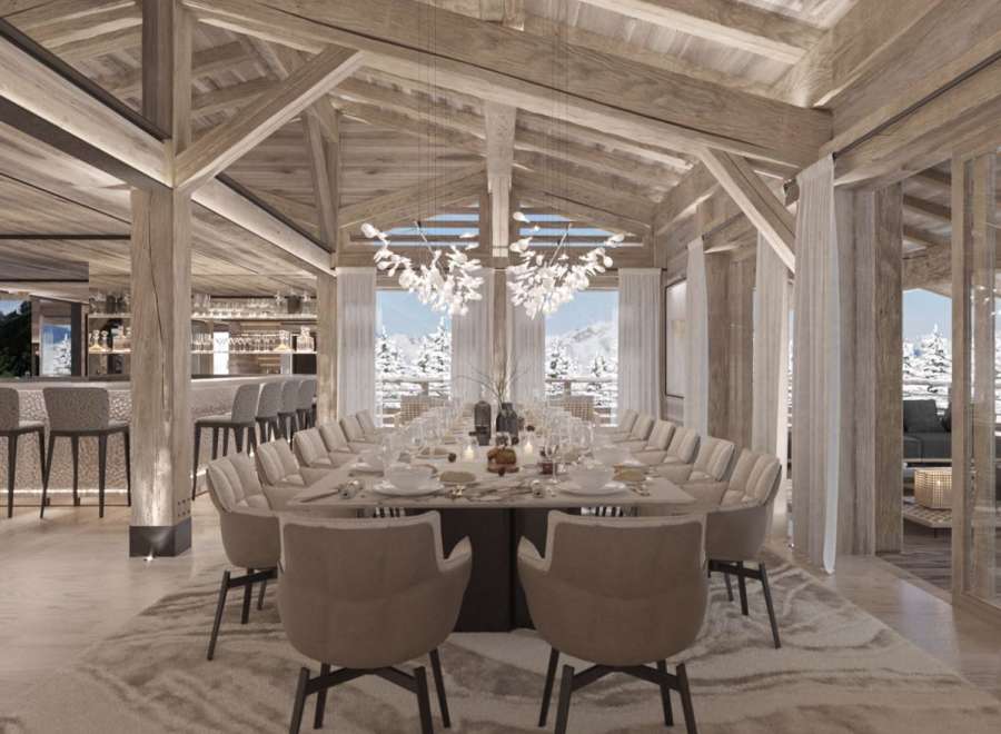 This luxurious chalet boasts a stunning open-plan dining area with a large table perfect for grand gatherings, complemented by a sophisticated bar area.