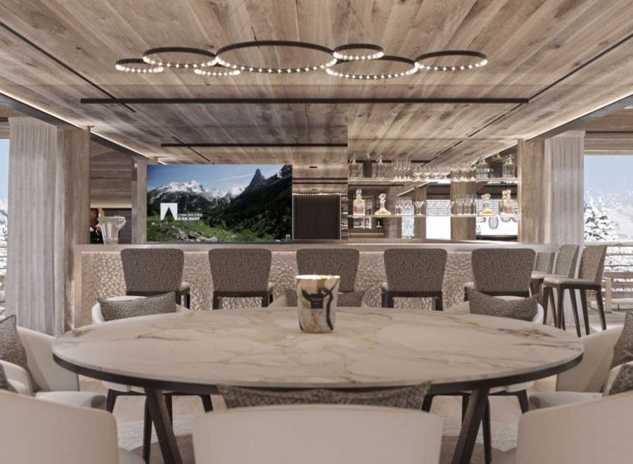 Luxury chalet with stunning mountain views and a spacious dining area perfect for entertaining.