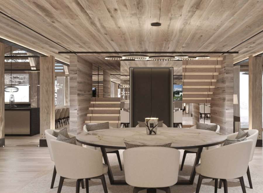 This stunning chalet boasts a spacious open-plan living area with a large marble dining table, perfect for entertaining guests.