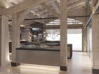 This stunning chalet boasts a spacious open-plan kitchen and bar area, perfect for entertaining guests.