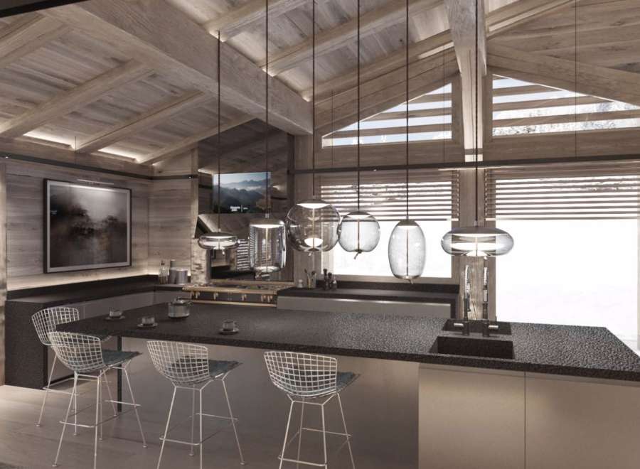 This stunning chalet boasts a spacious, open-plan kitchen with high-end finishes and a cozy atmosphere.