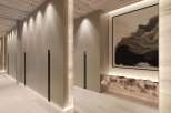This stunning hallway boasts a sleek, modern design with built-in storage and ambient lighting.
