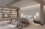 Luxurious mountain retreat boasting a stunning master bedroom with a cozy fur throw, built-in shelving, and modern pendant lighting.