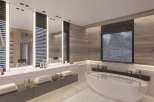 Luxurious bathroom with a freestanding bathtub and double vanity, featuring sleek modern design and wood paneling.