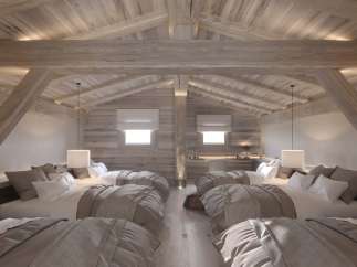 Rustic-chic chalet bedroom with exposed wooden beams and multiple beds, perfect for a family getaway.