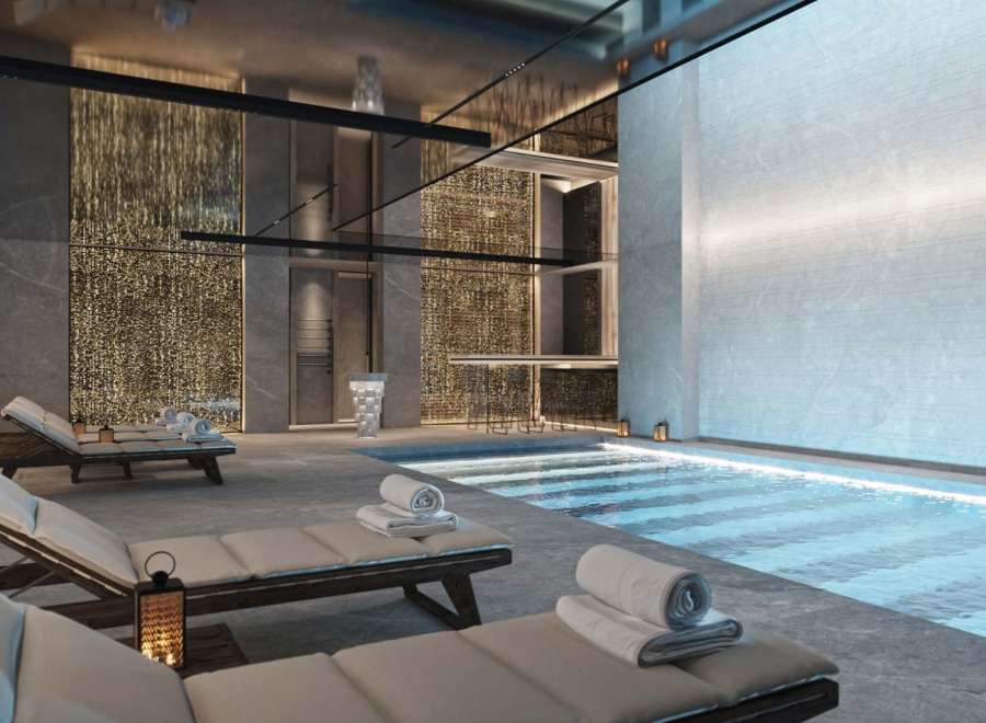Indulge in luxury at our exquisite spa, featuring a serene indoor pool and plush lounge chairs perfect for relaxation.