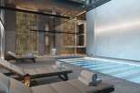 Indulge in luxury at our exquisite spa, featuring a serene indoor pool and plush lounge chairs perfect for relaxation.