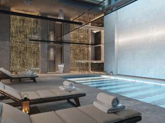 Indulge in luxury at our exquisite spa, featuring a serene indoor pool and plush lounge chairs perfect for relaxation.